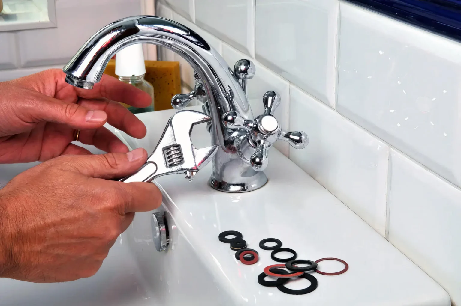 Plumber maintaining a bathroom faucet in Riverside